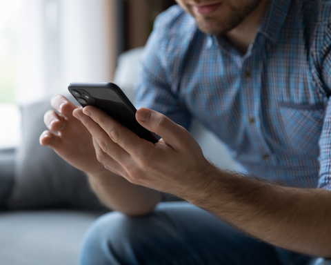 Person using a smartphone with a blurred background