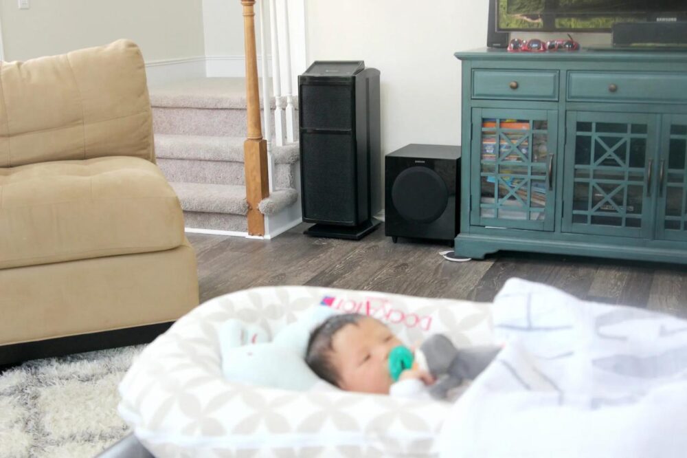 infant with Intellipure UltraFine unit in the background