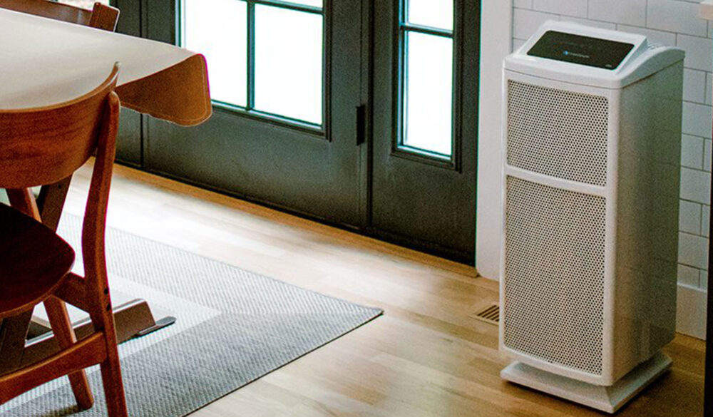 An Ultrafine 468 air purifier is in the kitchen next to the table. 