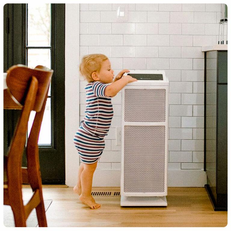 A child on his tip-toes playing with an Ultrafine Air Purification