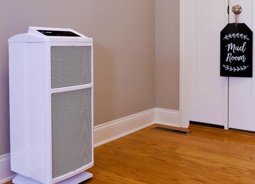 An Intellipure Ultrafine 468 air purifier in a home, placed next to the mud room for improved air quality. 